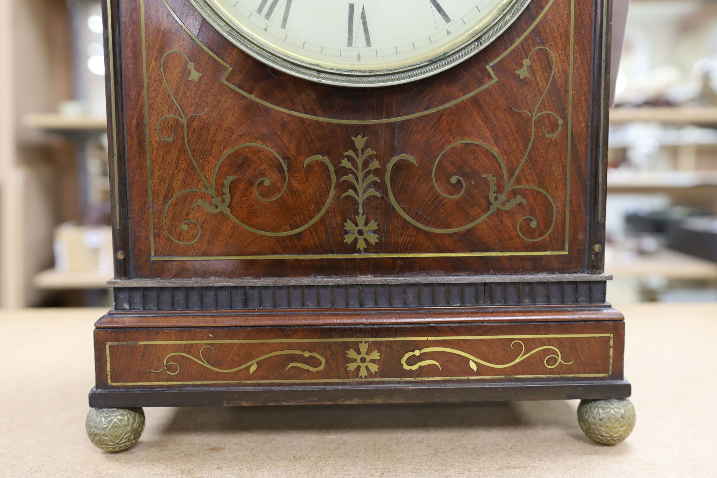 A late George III mahogany bracket clock with brass inlay, 65cm